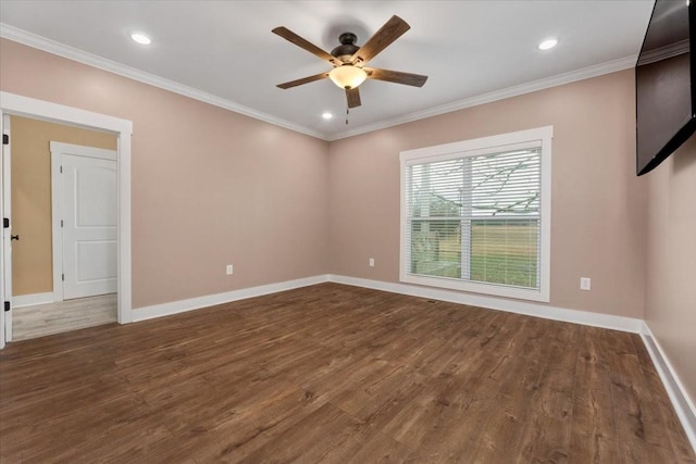 empty room featuring crown molding, dark hardwood / wood-style flooring, and ceiling fan