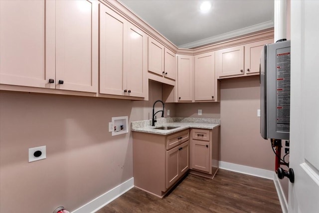 kitchen featuring light stone countertops, dark hardwood / wood-style floors, crown molding, and sink