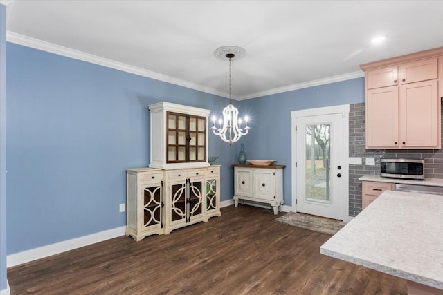 kitchen with decorative backsplash, appliances with stainless steel finishes, light brown cabinetry, crown molding, and dark wood-type flooring