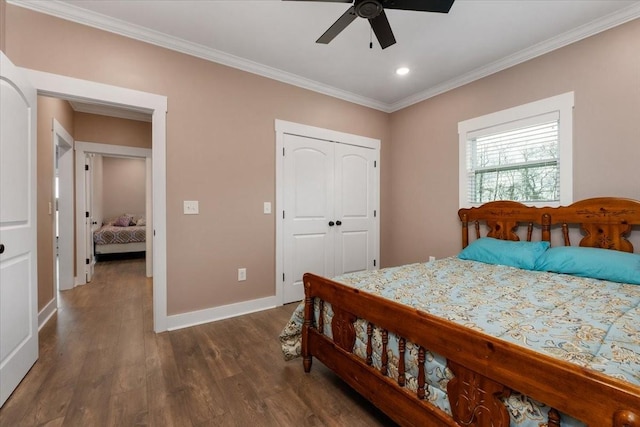 bedroom featuring a closet, ceiling fan, dark hardwood / wood-style flooring, and ornamental molding