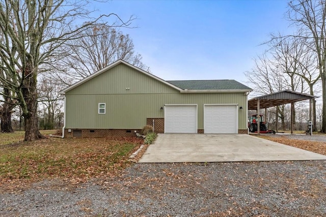 view of side of property with a garage