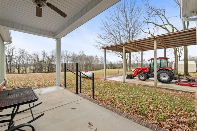 view of patio with a carport and ceiling fan