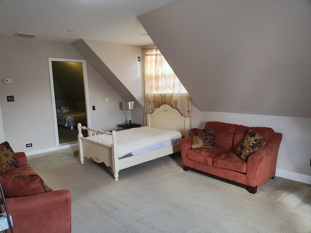 carpeted bedroom with vaulted ceiling