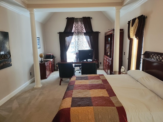 carpeted bedroom featuring decorative columns, crown molding, and vaulted ceiling