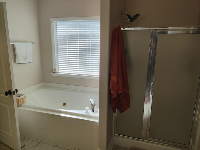 bathroom with tile patterned floors and separate shower and tub