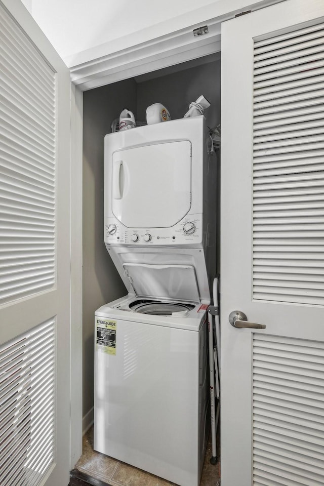 laundry room featuring stacked washer / dryer