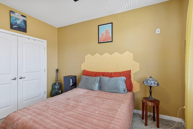 carpeted bedroom with a closet