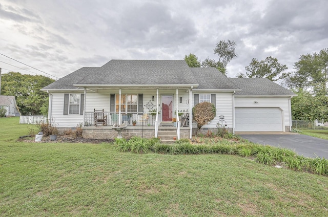 ranch-style home featuring a porch, a garage, and a front lawn