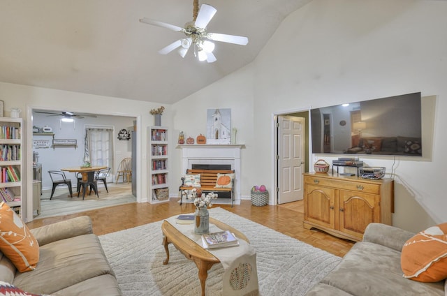 living room with ceiling fan, light parquet floors, and high vaulted ceiling