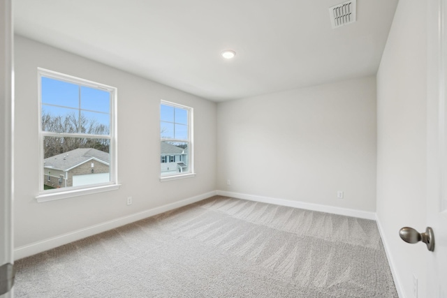 empty room featuring carpet floors