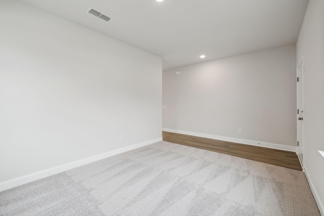 empty room featuring light colored carpet