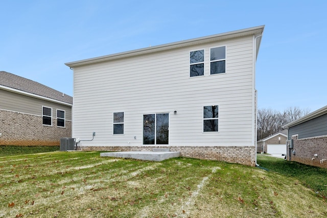 back of house with a lawn