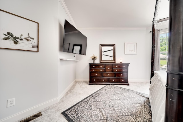 carpeted bedroom featuring ornamental molding