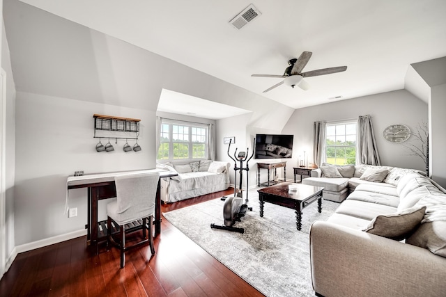 living room with dark hardwood / wood-style flooring, ceiling fan, and lofted ceiling