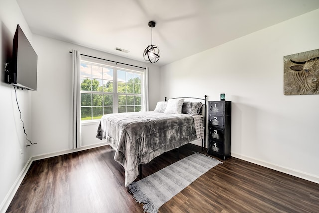 bedroom featuring dark hardwood / wood-style floors