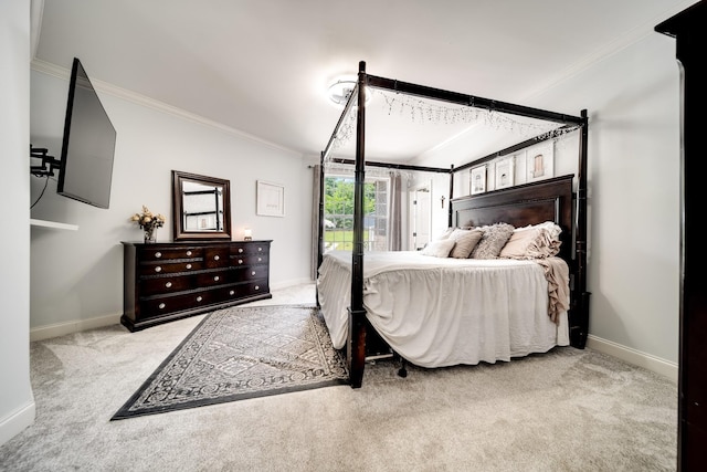 carpeted bedroom featuring crown molding