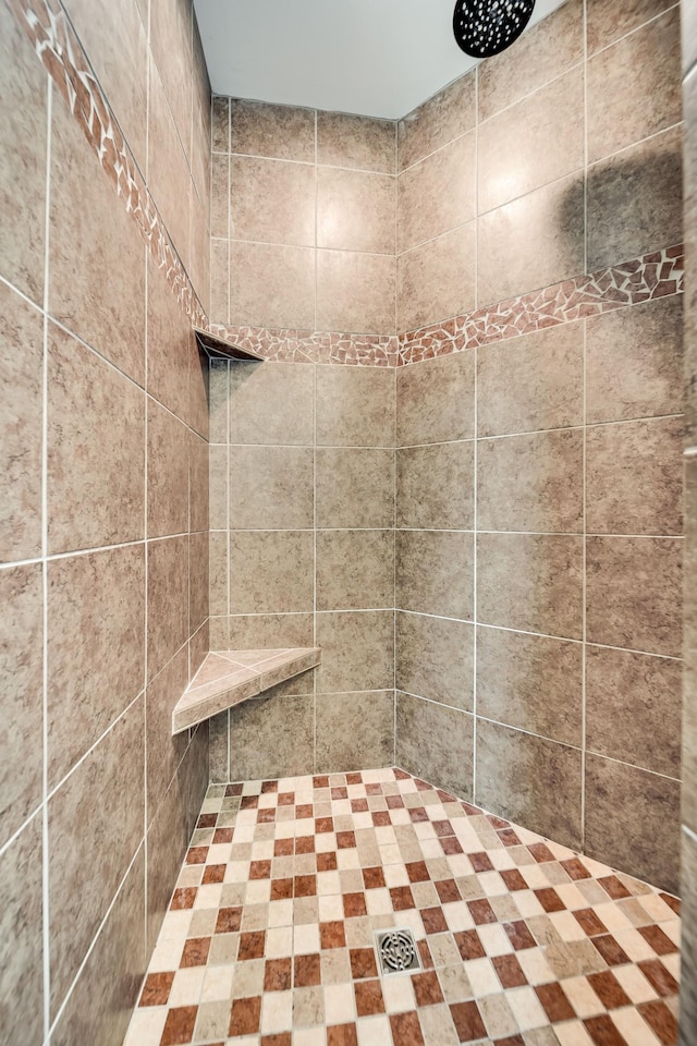 bathroom with tiled shower