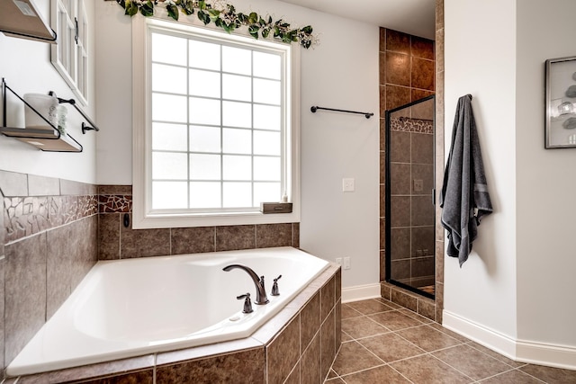 bathroom with tile patterned floors and separate shower and tub