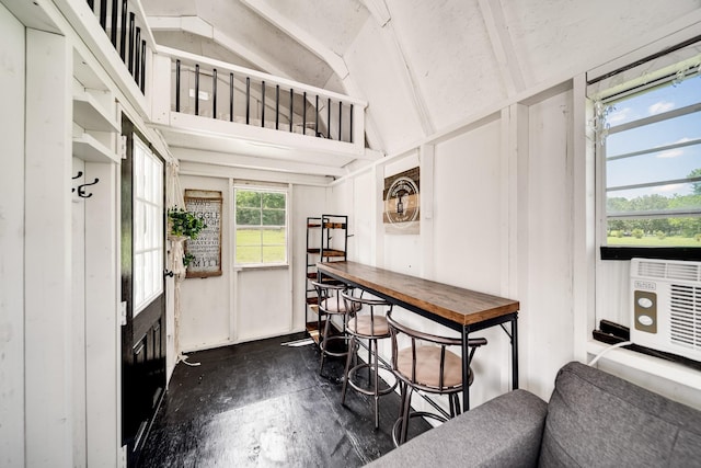 interior space with a healthy amount of sunlight and vaulted ceiling