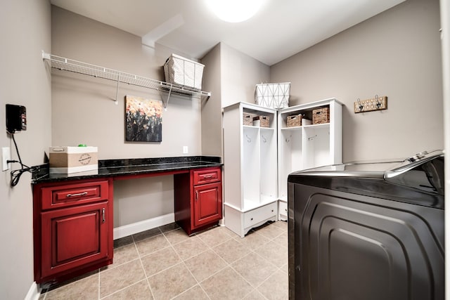 laundry room featuring independent washer and dryer and light tile patterned flooring