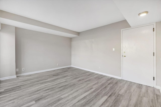 unfurnished room with light hardwood / wood-style floors