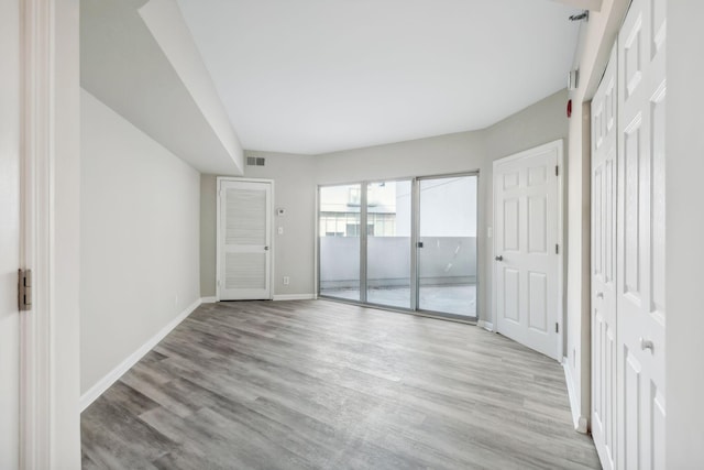 unfurnished room featuring light hardwood / wood-style flooring