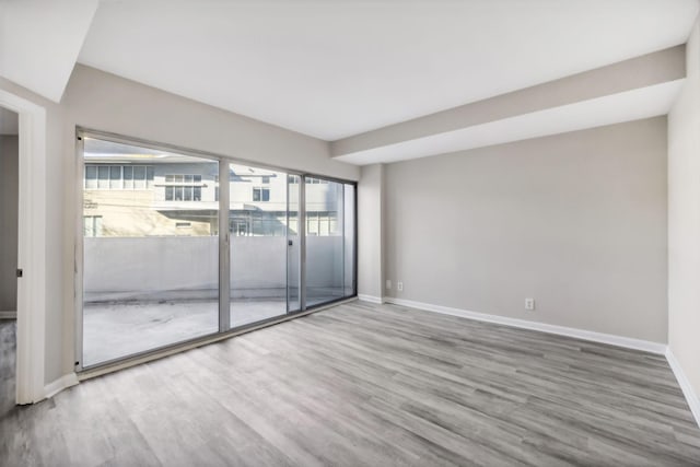 spare room featuring hardwood / wood-style floors