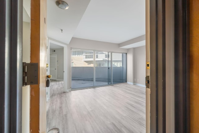 spare room with light wood-type flooring