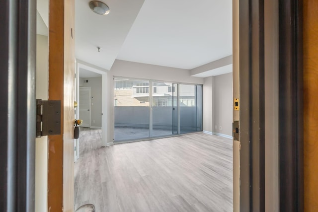 900 19th Ave S Unit 103, Nashville, TN 37212 - spare room featuring light wood-style floors and fire sprinkler in ceiling