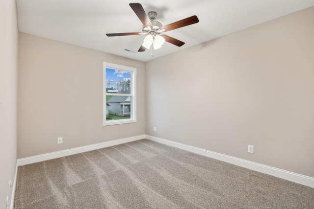 carpeted empty room with ceiling fan