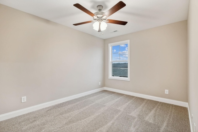 unfurnished room with carpet and ceiling fan