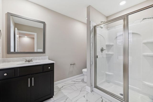 bathroom featuring vanity, toilet, and walk in shower