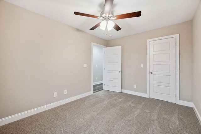 unfurnished bedroom featuring ceiling fan and carpet floors