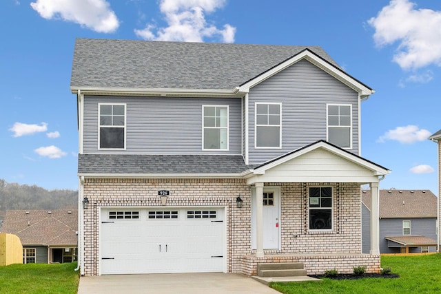 view of front facade featuring a front lawn and a garage