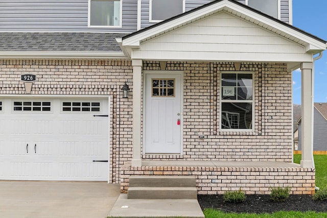 property entrance with covered porch and a garage