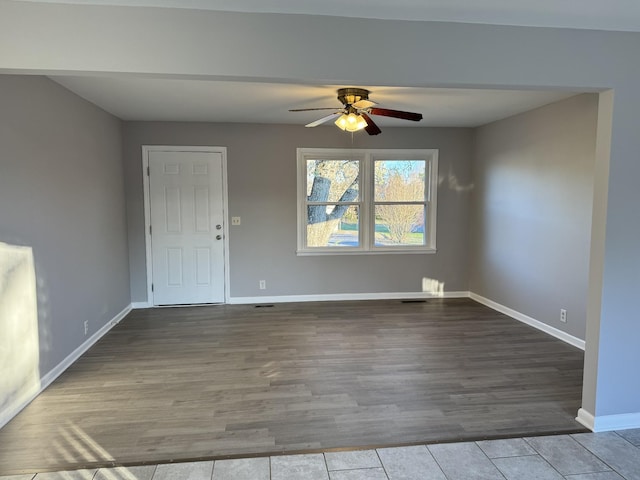 spare room featuring hardwood / wood-style flooring and ceiling fan