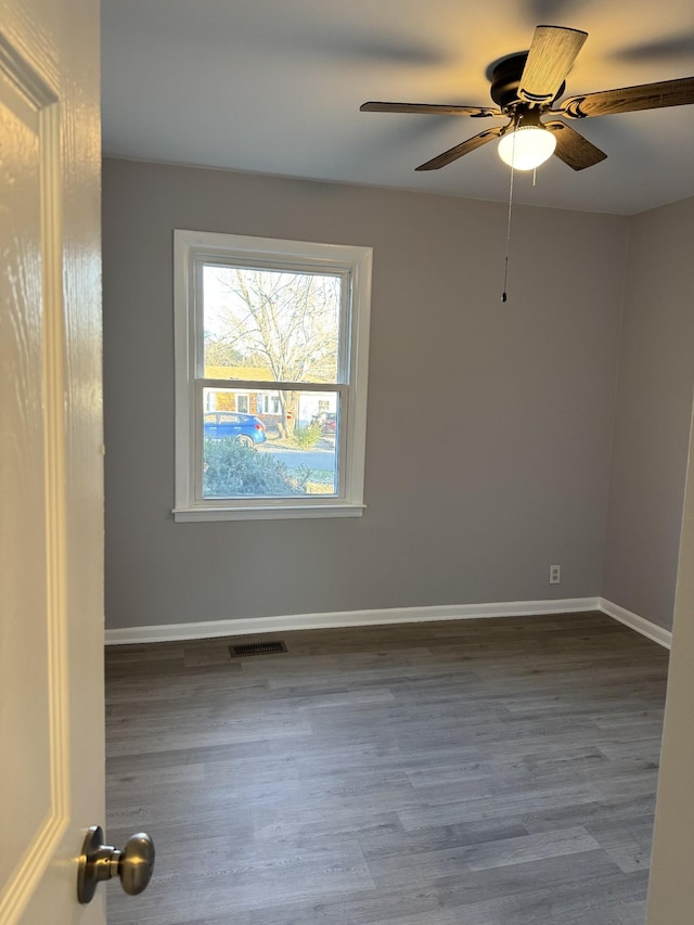 unfurnished room featuring hardwood / wood-style flooring and ceiling fan