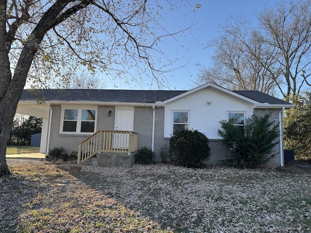 ranch-style home featuring a carport