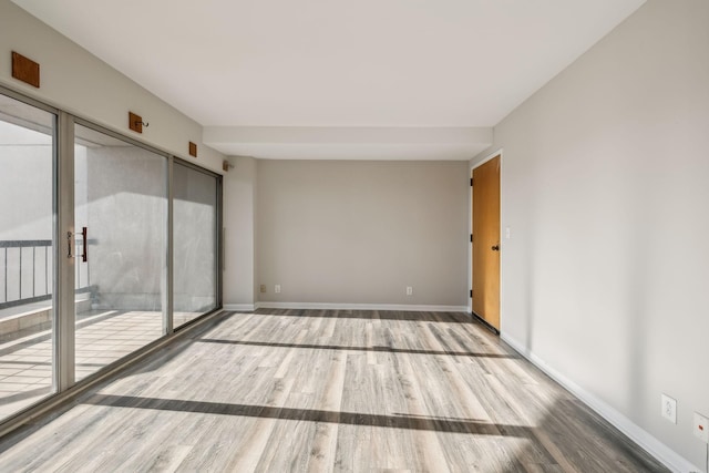 spare room featuring hardwood / wood-style flooring