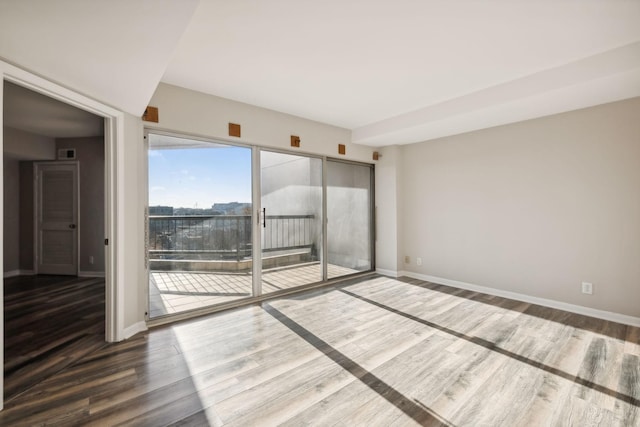 unfurnished room featuring dark hardwood / wood-style floors