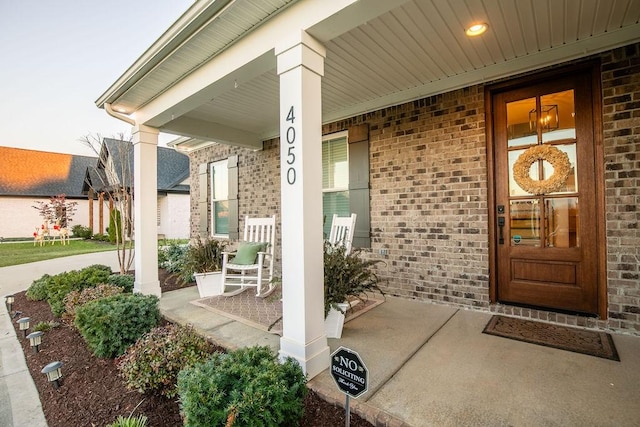 property entrance featuring covered porch