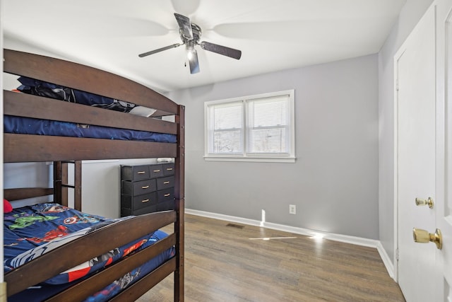 bedroom with hardwood / wood-style floors and ceiling fan