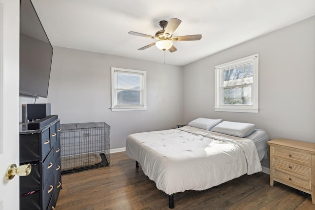 bedroom featuring ceiling fan and dark wood-type flooring