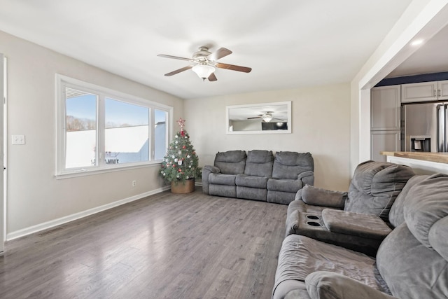 living room featuring light hardwood / wood-style flooring and ceiling fan