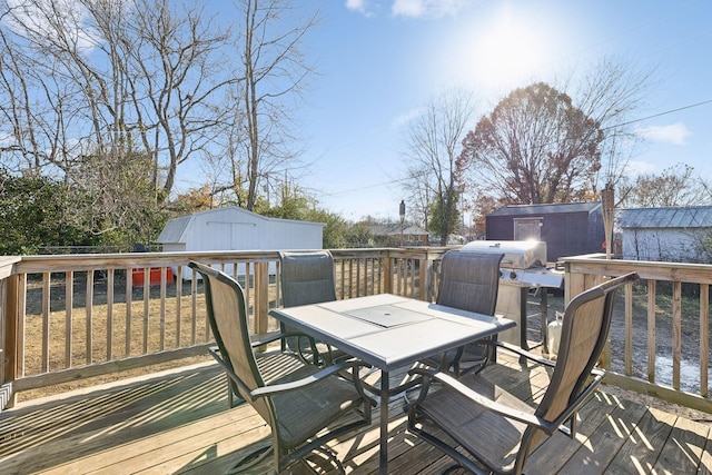 wooden deck featuring a storage unit