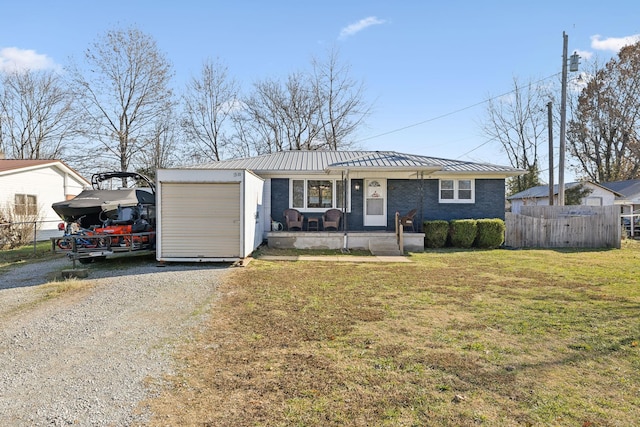 single story home with a front yard and a garage