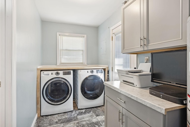 clothes washing area with washing machine and dryer