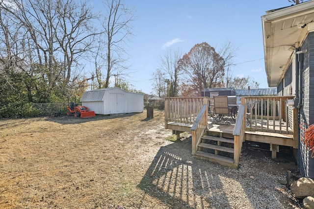 view of yard with an outbuilding and a deck