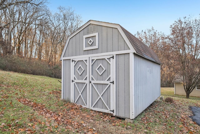 view of outbuilding featuring a lawn