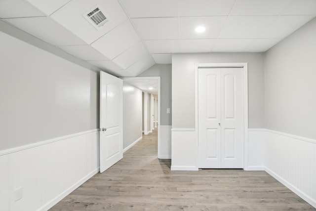 corridor with light wood-type flooring